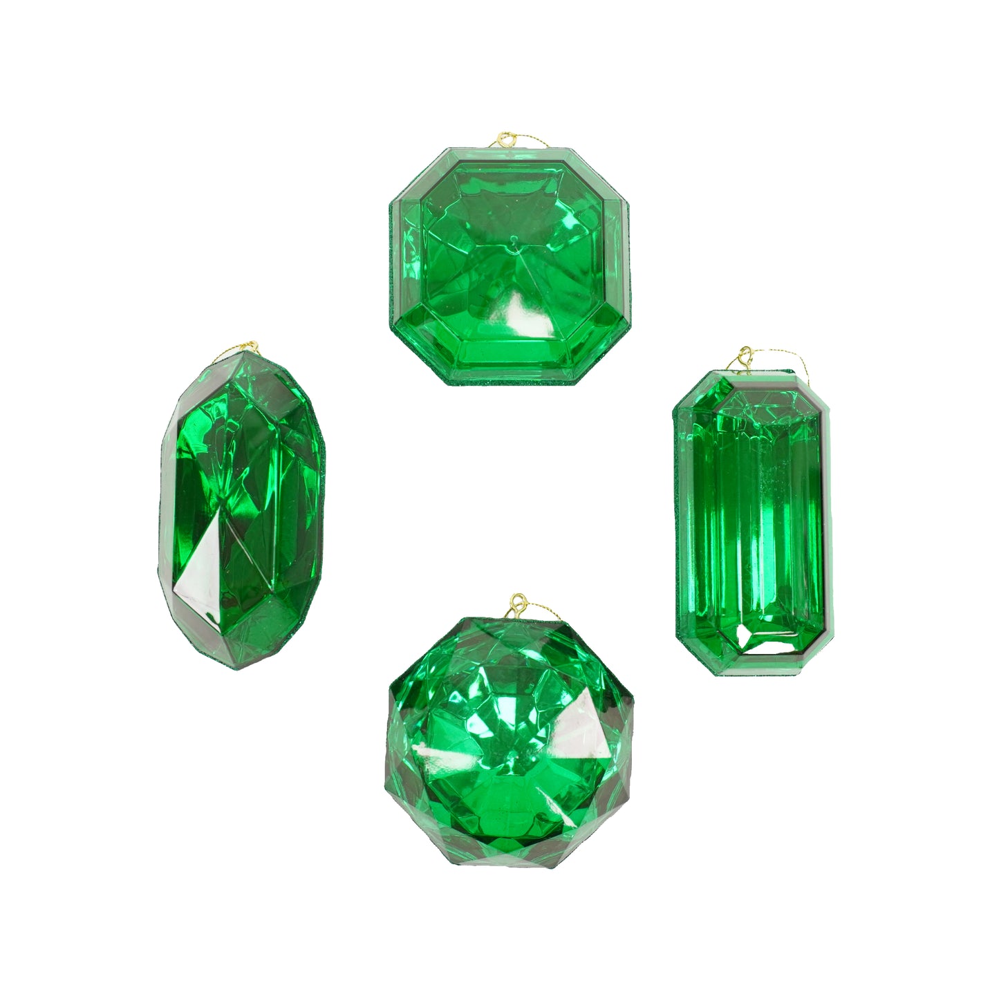 a group of three emerald colored jewels on a white background
