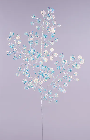 a branch with blue and white flowers, creating a visually appealing and delicate arrangement.