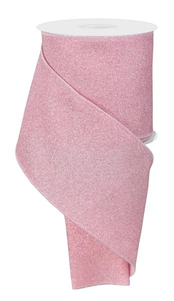 a roll of pink glitter paper on a white background