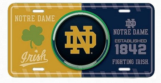 a license plate with the Notre Dame logo and text, including the words "Notre Dame" and "Established 1842".
