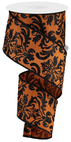 a roll of orange and black ribbon on a white background