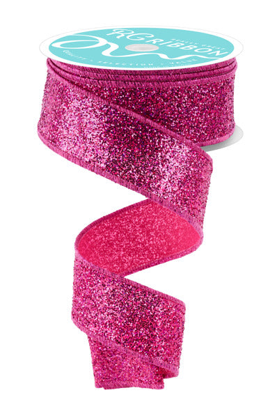 a roll of pink glitter ribbon on a white background