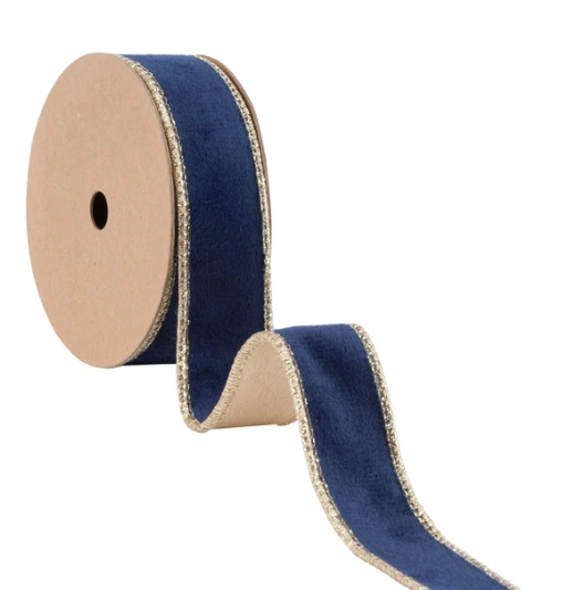 A roll of blue velvet ribbon with gold trim.