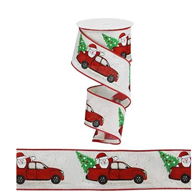 a roll of christmas ribbon with santa clause on it
