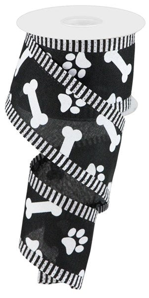 a roll of black and white dog paw tape