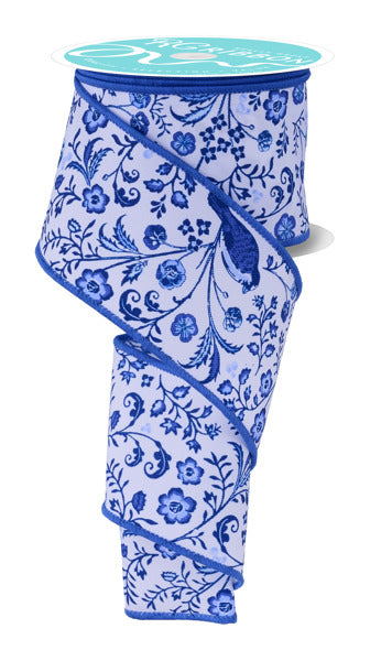 a blue and white vase sitting on top of a table