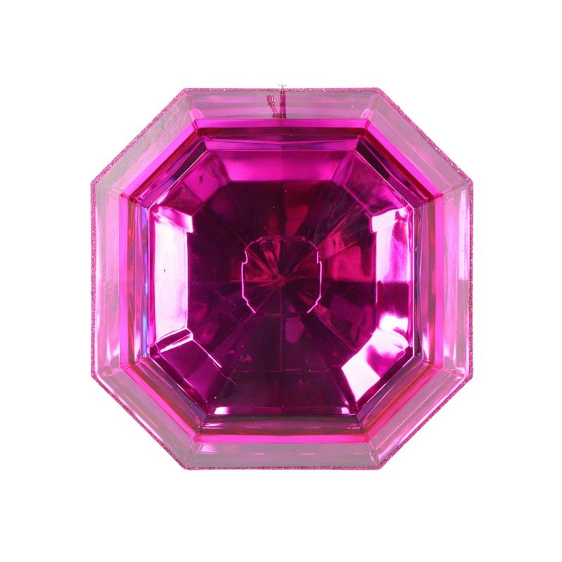 a close up of a pink diamond on a white background
