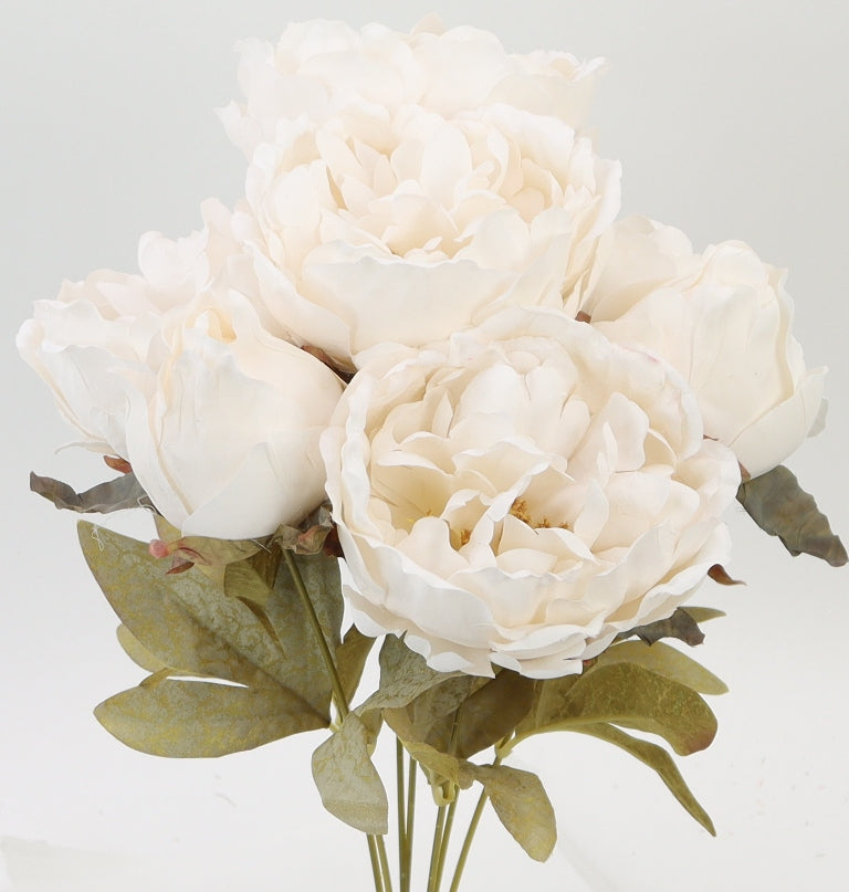 A bouquet of beautiful white peonies with green leaves.