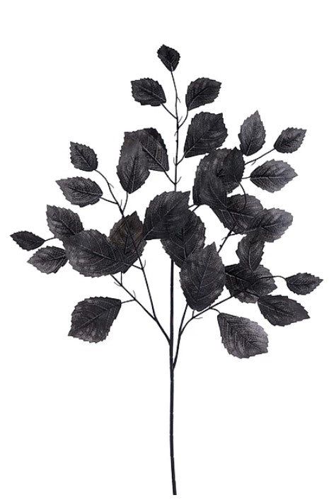 A black and white image of a branch with numerous dark leaf-like shapes, creating a striking contrast against the white background.