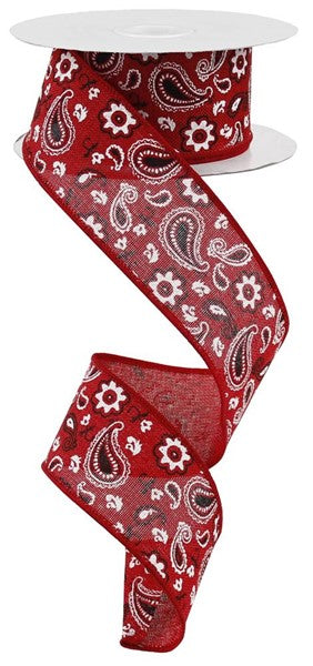 a red ribbon with a paisley pattern on it
