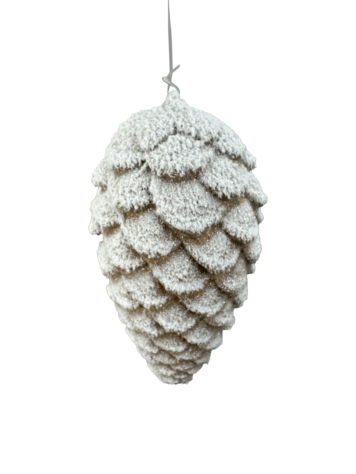 A close-up view of a snow-covered pine cone, with its intricate scales and textures clearly visible against a neutral background.