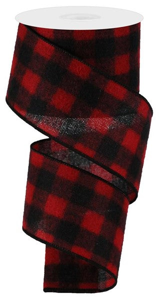 a red and black plaid ribbon on a white background