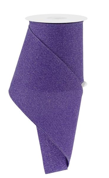 a roll of purple glitter ribbon on a white background
