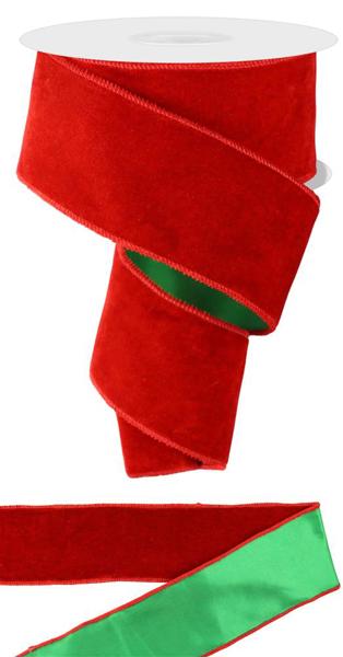 a roll of red velvet ribbon next to a roll of green velvet ribbon