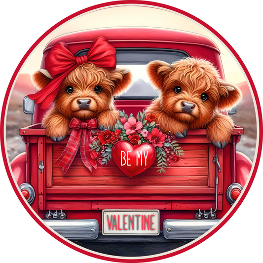 two teddy bears sitting in the back of a red truck