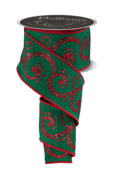 a roll of green and red ribbon on a white background
