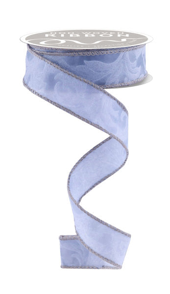 a roll of blue satin ribbon on a white background