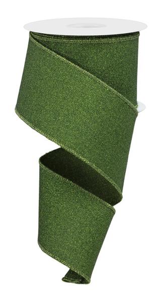 a roll of green glitter ribbon on a white background