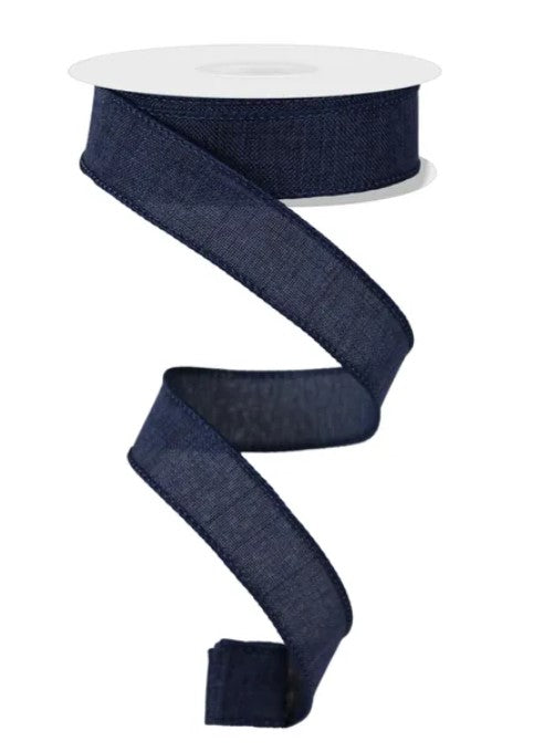 A roll of dark blue, coiled ribbon is shown against a white background.