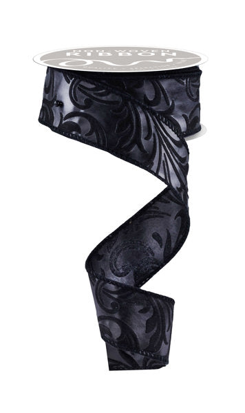 a roll of black ribbon on a white background
