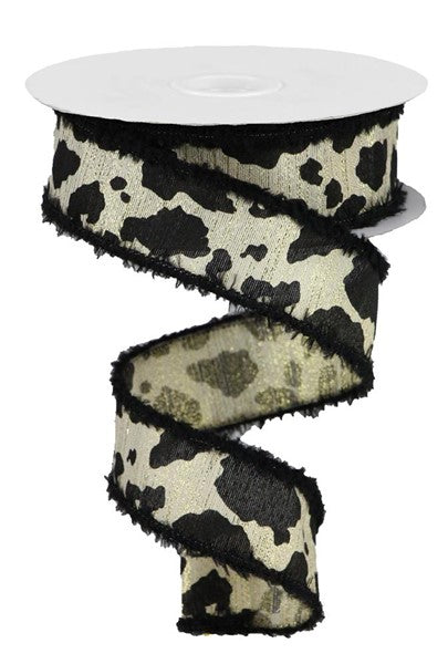 a black and white cow print ribbon on a white background