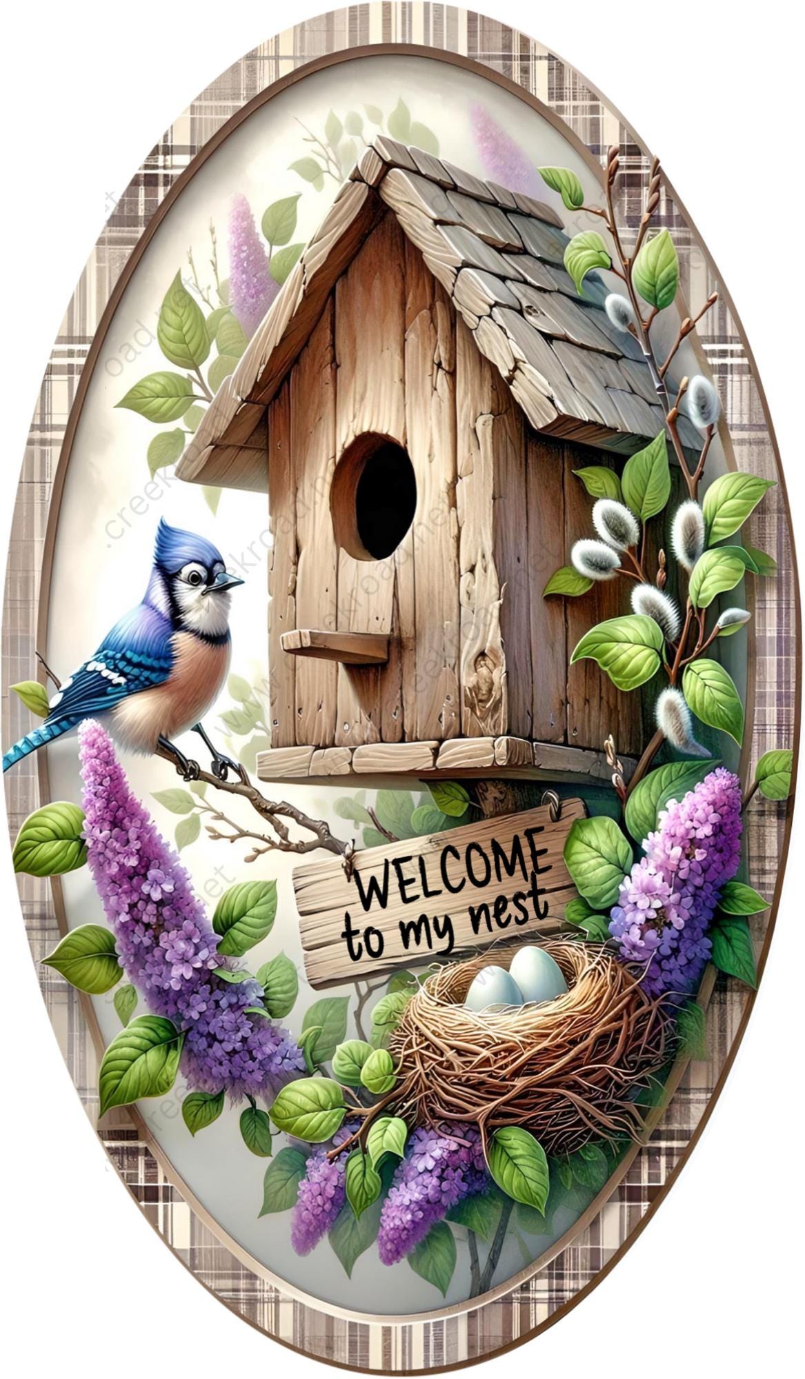 a plate with a bird and a birdhouse on it