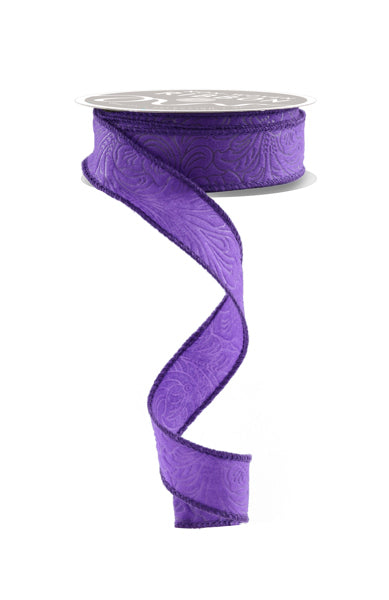 a roll of purple satin ribbon on a white background