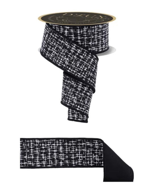 a black and white checkered pattern on a ribbon, with a gold-colored label on top.