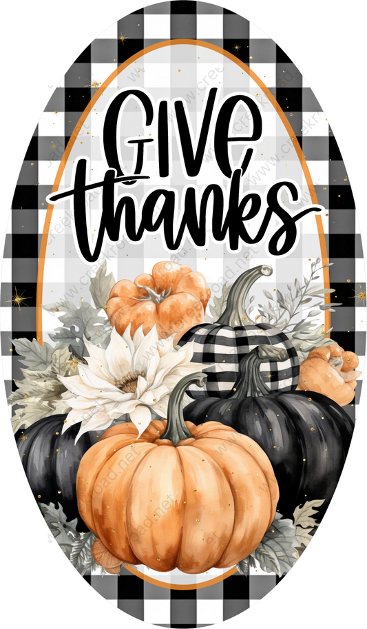 a black and white checkered circle with a pumpkin and flowers