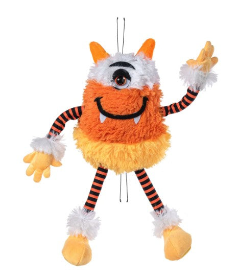 A plush toy of a monster with a large head, orange and white body, and striped legs.