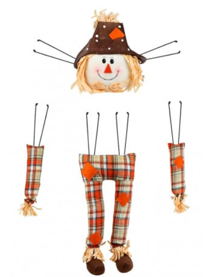 a doll with a hat and plaid pants