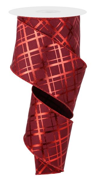 a roll of red ribbon on a white background