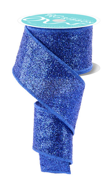 a roll of blue glitter ribbon on a white background
