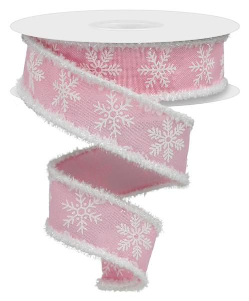 a pink ribbon with white snowflakes on it