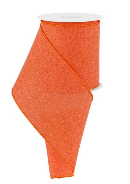 a roll of orange glitter ribbon on a white background