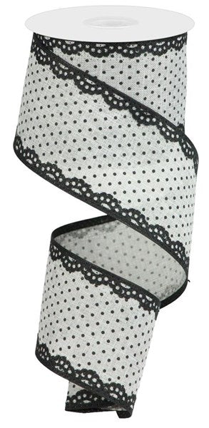 a roll of black and white polka dot ribbon