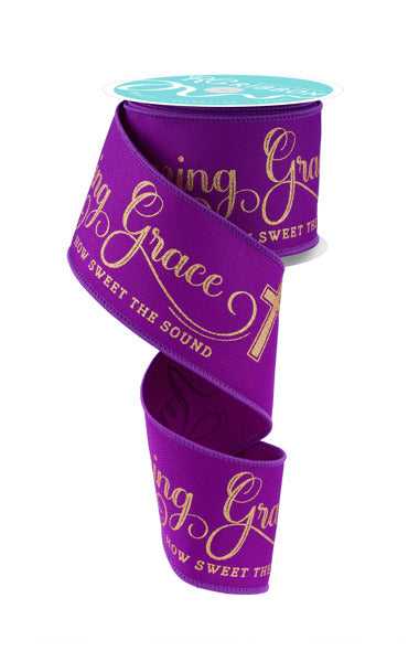 a purple ribbon with gold lettering on it