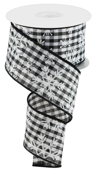 a black and white checkered ribbon with snowflakes on it