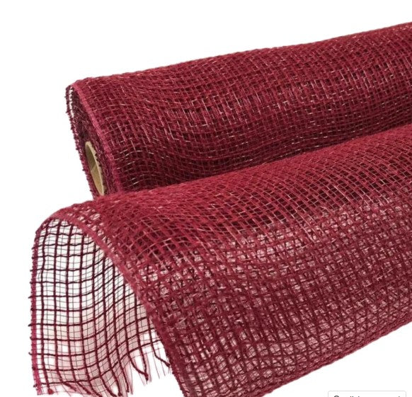 a roll of red wire mesh on a white background