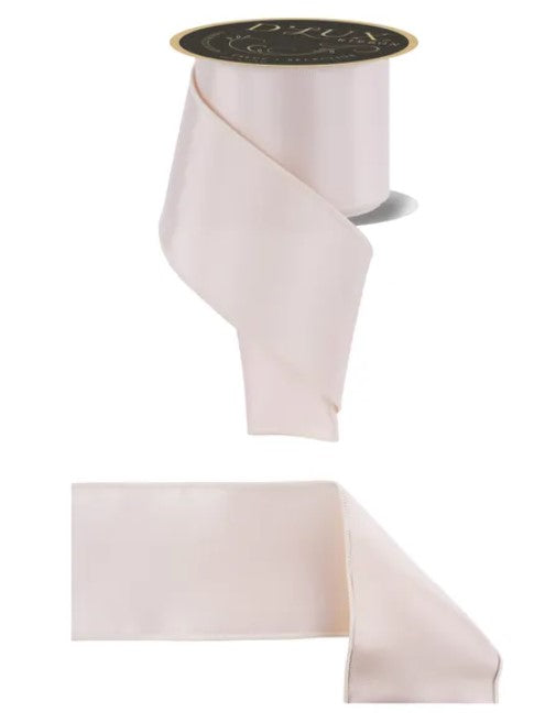 a pink ribbon and a black and gold label.