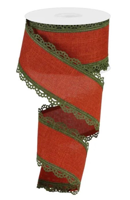 A red and green decorative ribbon with a scalloped edge and lace trim.