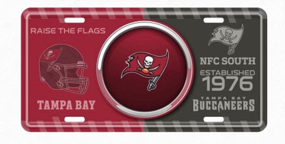 a license plate with the Tampa Bay Buccaneers logo and text, including the words "Raise the Flags" and "NFC South Established 1976".