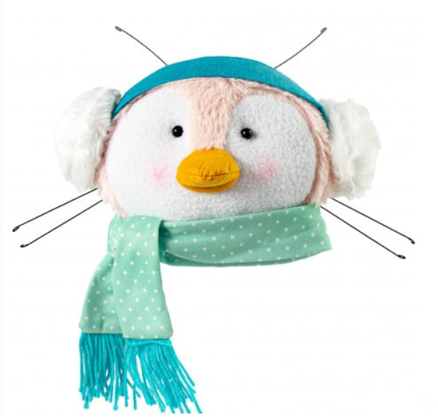 a stuffed animal wearing a blue hat and scarf