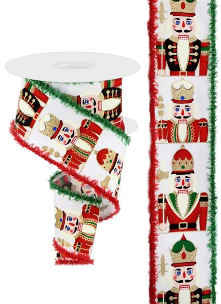 a roll of christmas ribbon next to a roll of christmas decorations