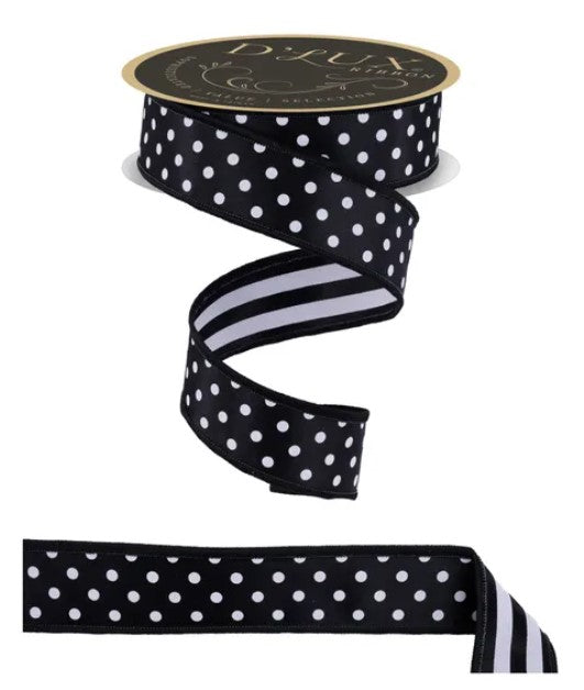 a black and white polka dot ribbon with a gold label.