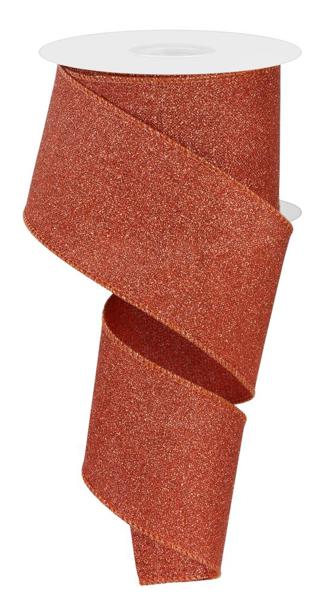 a roll of glitter ribbon on a white background