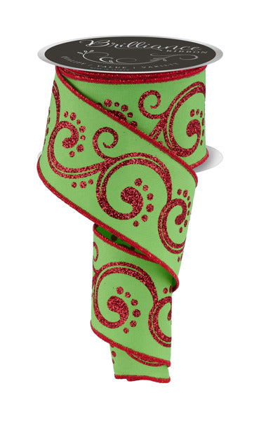 a roll of green and red ribbon on a white background