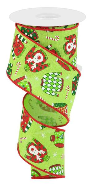 a roll of green christmas ribbon with owls on it