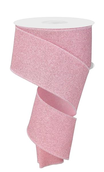 a roll of pink glitter ribbon on a white background