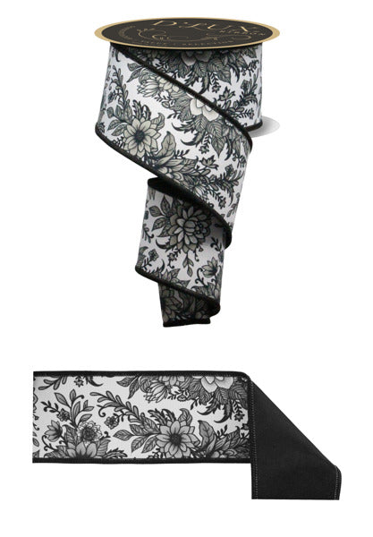 a black and white ribbon with flowers on it